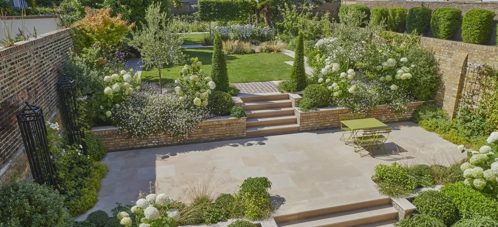 Complete Putney garden with limestone terrace, steps and planted borders