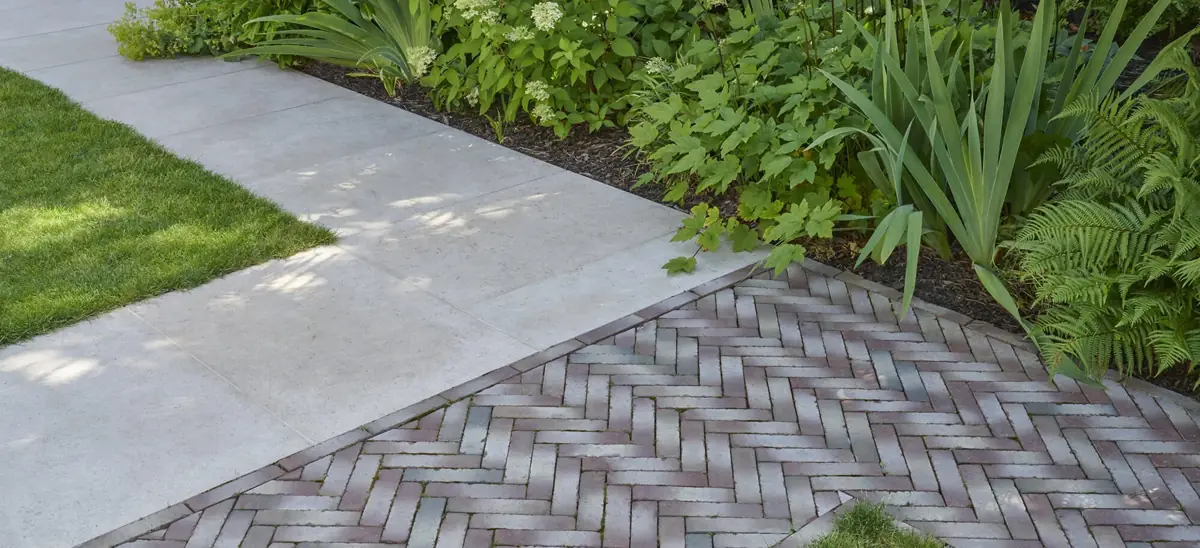 Limestone and clay paving meet in the Putney garden